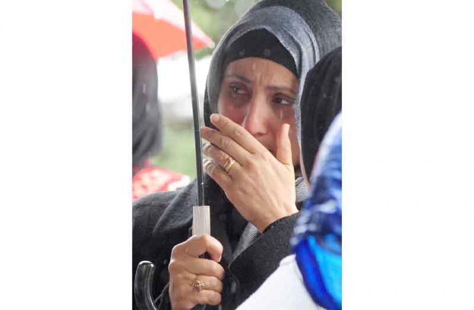 Women in headscarves reflect on the situation in Gaza.