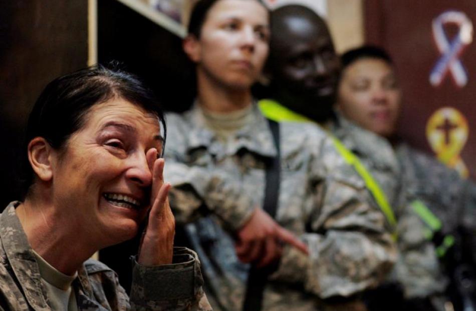 US Army Command Sgt. Maj. Julia Kelley weeps as she watches the inauguration of US President...
