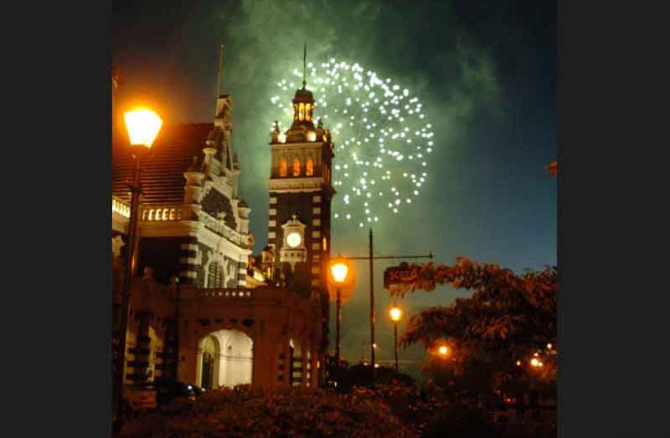 Another view of the fireworks, from Anzac Square in front of the Dunedin Railway Station. Photo...