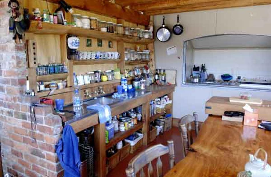 Shelves are made from unwanted wood offcuts. The "outdoor" fridge is at the rear.