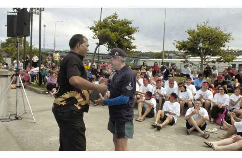 Otago Museum director Shrimrath Paul presents DCC's CEO Jim Harland with the trophy to the...