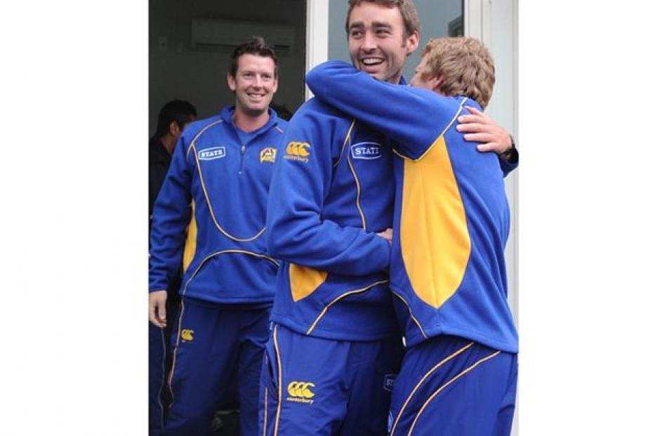 Otago Volt Mathew Harvie celebrates with team mates.