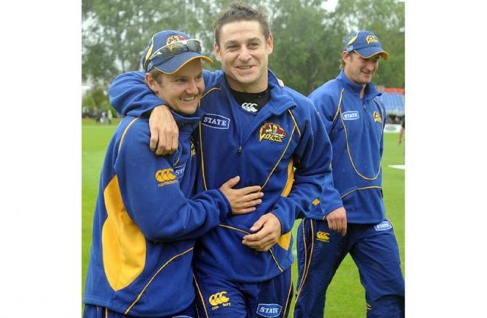 Otago Volts coach, Mike Hesson (left) and Nathan McCullum celebrate.