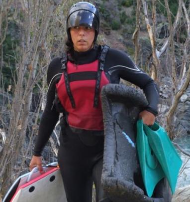 A member of the Mad Dog River Boarding trip emerges from the river.