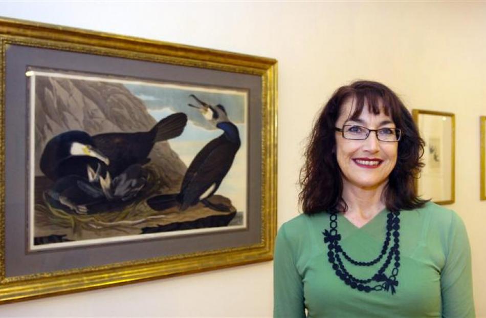 Elizabeth Caldwell at the Dunedin Public Art Gallery. Behind her is John James Audubon's 'Common...