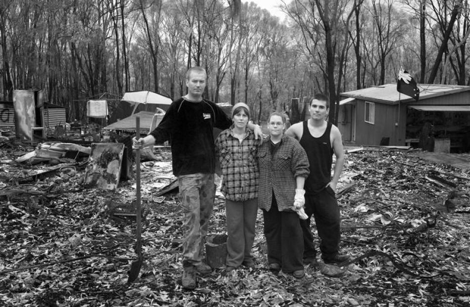 Marco Van Amsterdam, Tania Kenny and her children Mellissa and Shane Commans with the remains of...