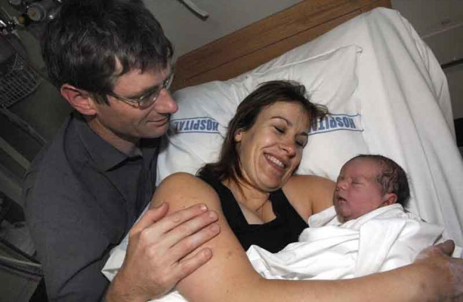 5:00pm: Roger and Trish Oakley with their daughter Isabella, born at 3pm at Queen Mary Maternity...