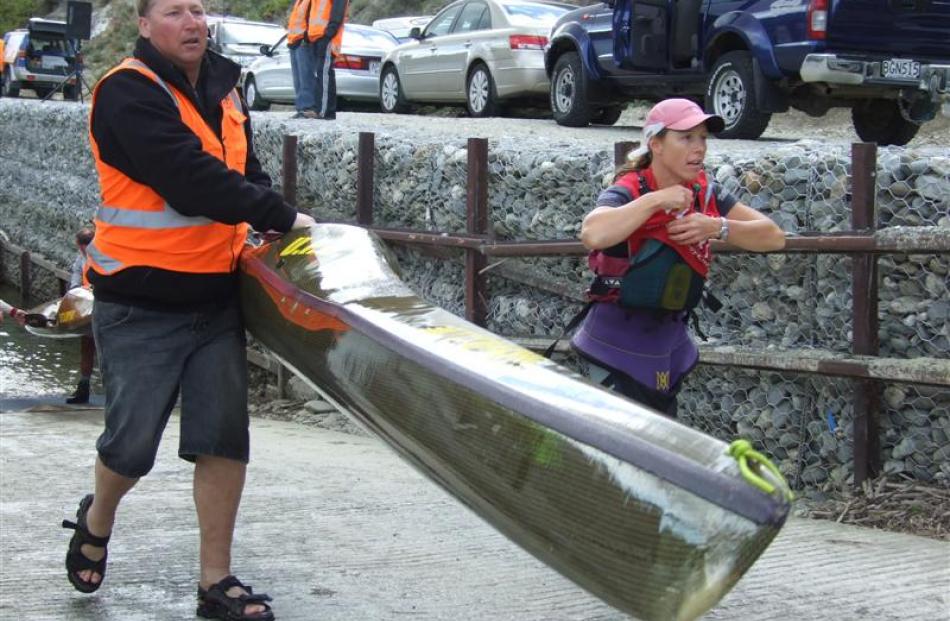 Individual Open Women's competitor Wanaka's Jo Williams transitions out of the first kayak leg on...