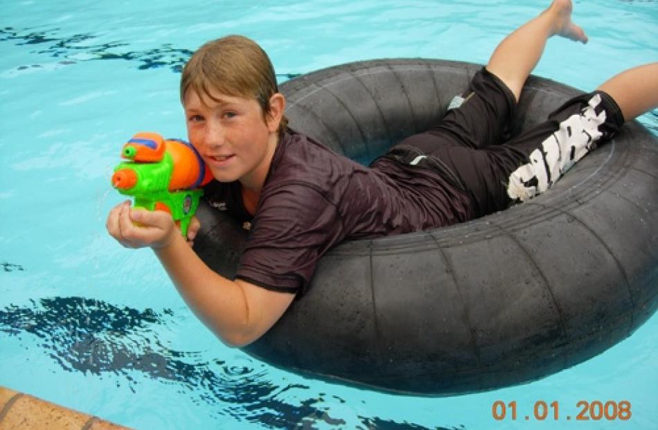 Jono Martin (10) is ready to fire his water gun while on his family holiday in Brisbane. Photo by...