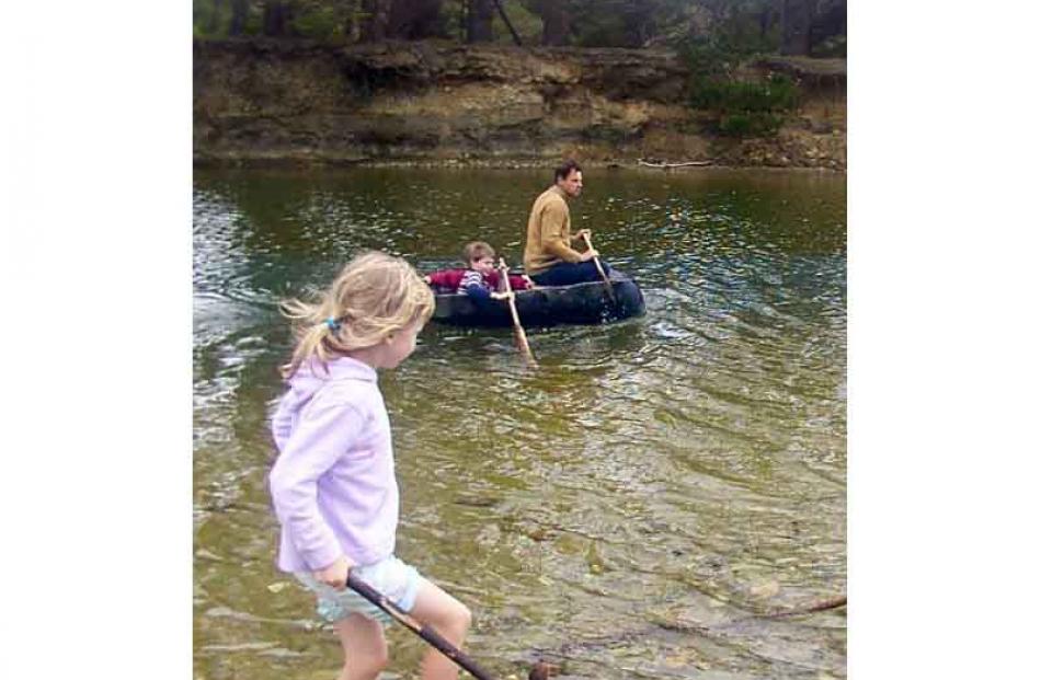 John Baster with son Henry in a coracle on the lagoon at the mouth of the Big Kuri Creek in...