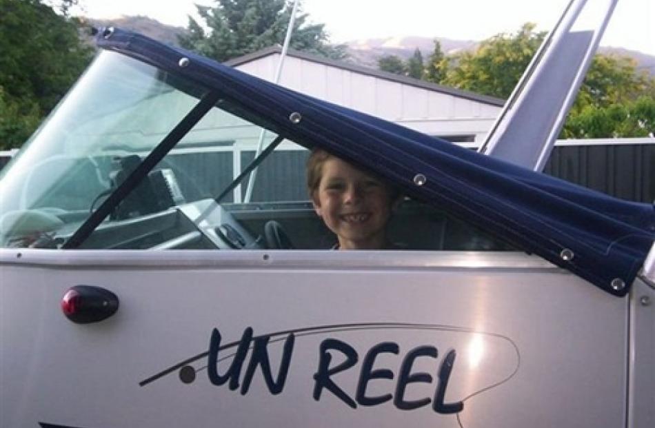 So excited about his first ride on a boat at Clyde, Jordan (8) climbed in under the cover and hid...