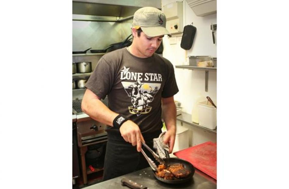 Head chef Tafao Campbell is already busy in the Lonestar kitchen. Photo by Emily Adamson.