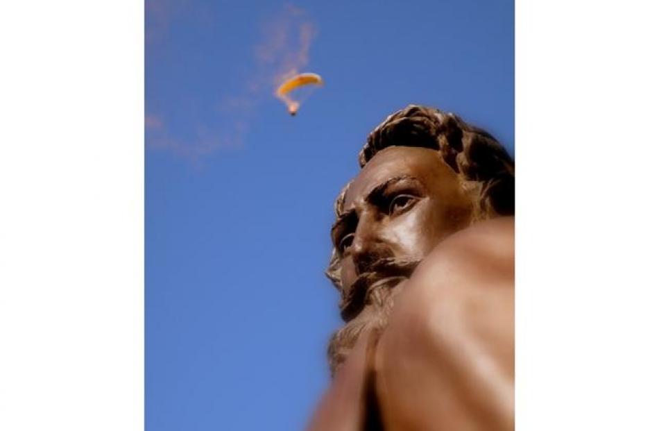 A competitor in the Skydiving Championships can be seen behind the Gilbert Rees statue in...
