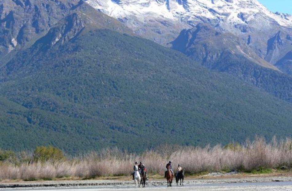 Wilderness trek ... taking in the views of the Dart and Rees river valley delta from horseback...
