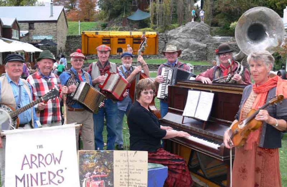 The Arrow Miners Band members entertains the crowds during the market day on the Buckingham St...
