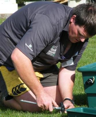 Foothills Young Farmers’ Club member Paul Sargent, Ashburton, plumbs a water trough in the...