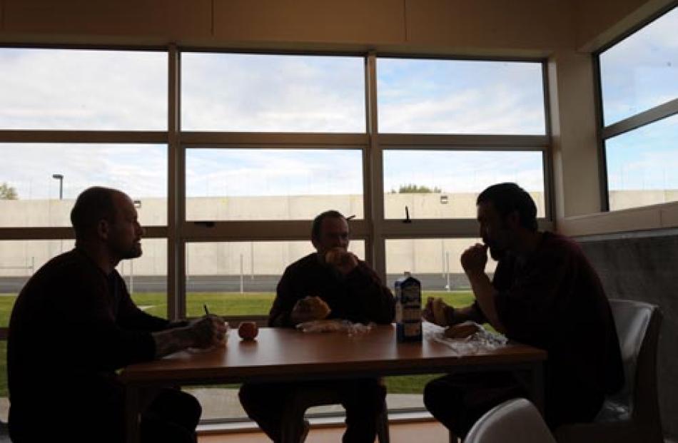 Prisoners eating their lunches.