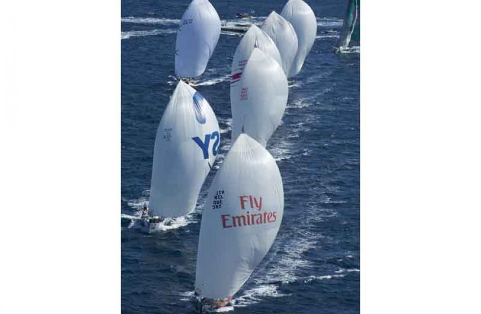 Team New Zealand lead the fleet on the first leeward leg of race nine, Day Four.