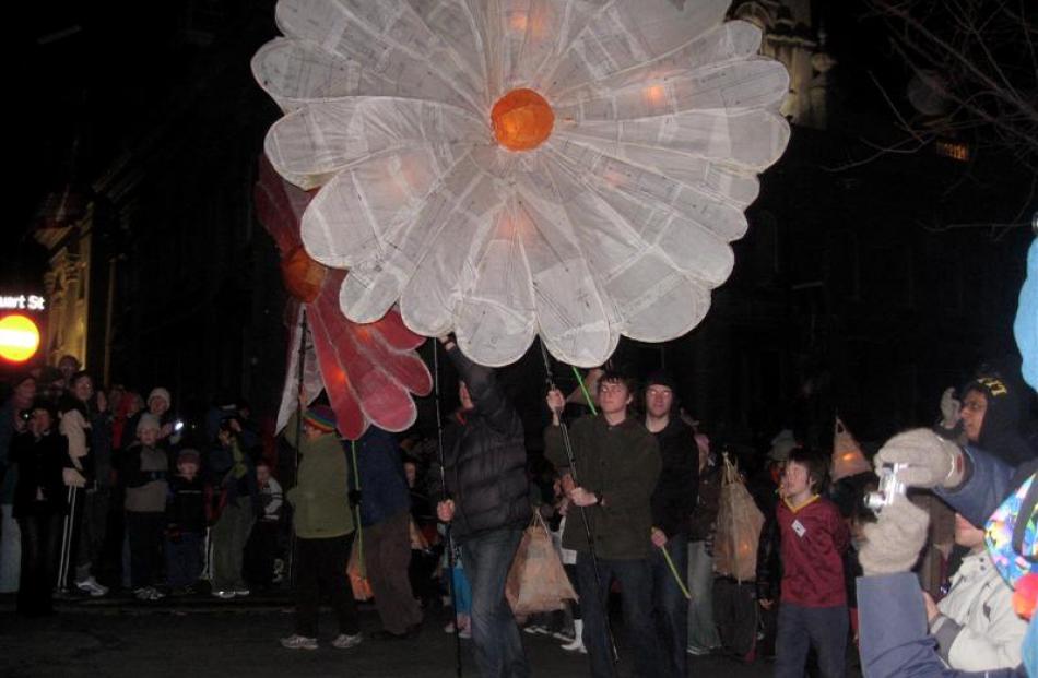 Giant sunflower lantern in procession around the Octagon. Photo by Stella Chisholm