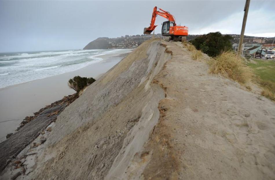 Contractors dump sand on to the dunes at the end of Moana Rua Rd. Photo by Stephen Jaquiery.