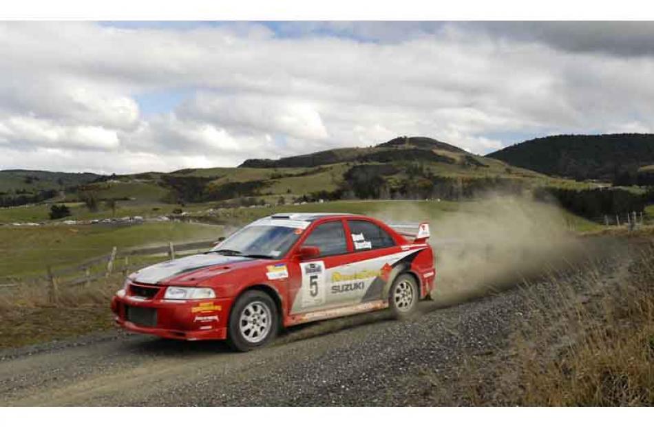 Driver Dean Bond and Co-driver Craig Barclay of Balclutha in their Mitsubishi EVO 6.5 on Special...