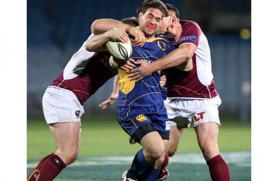 Otago's Karne Hesketh tries to bust his way through the Southland defence.