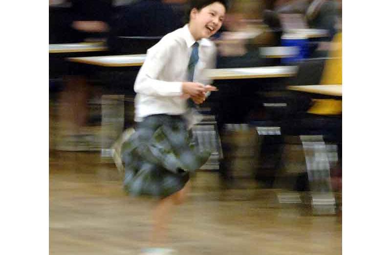 Prao Chittapraneerat (12), a Year 8 pupil from St Hildas Collegiate School, runs to deliver the...