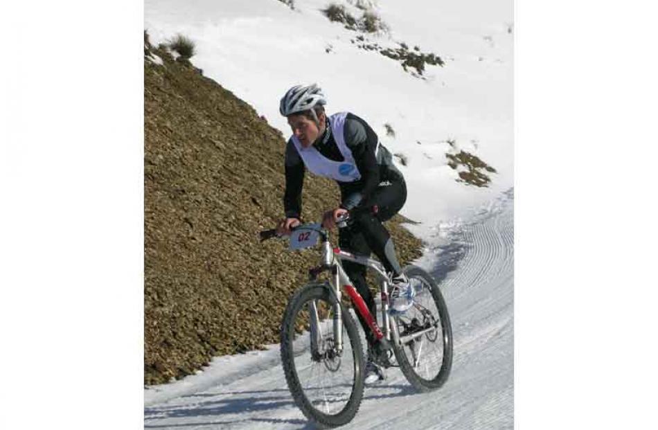 Men's race winner Nat Anglem during his second bike lap.