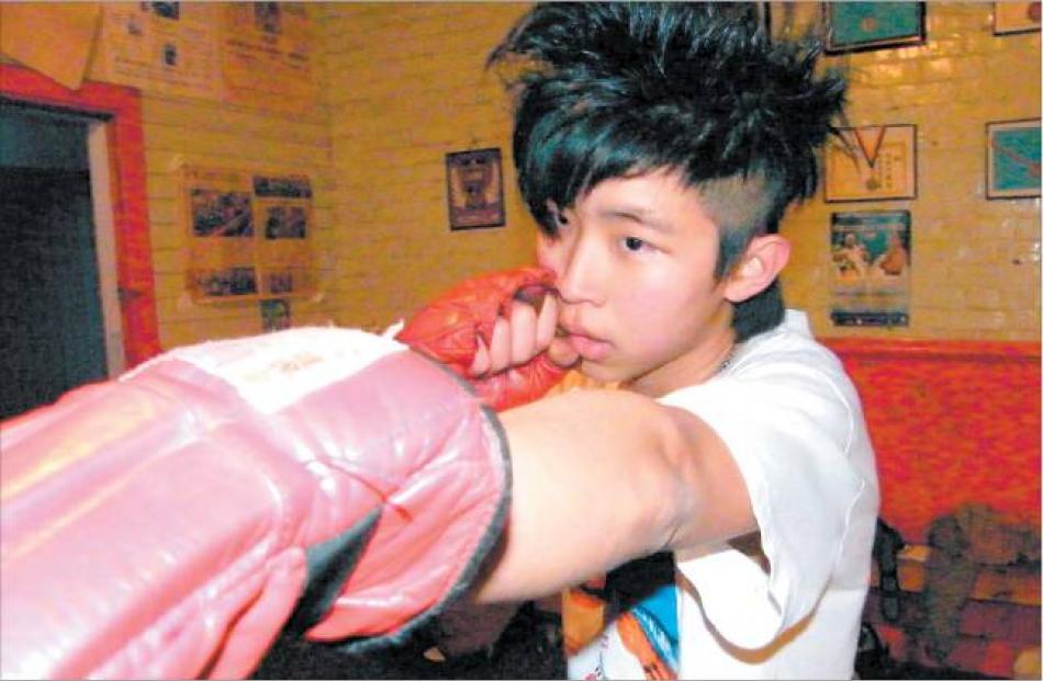 Straight left: Malaysian student Yeow Lim (16) finds focus at the Gore Boxing Club.