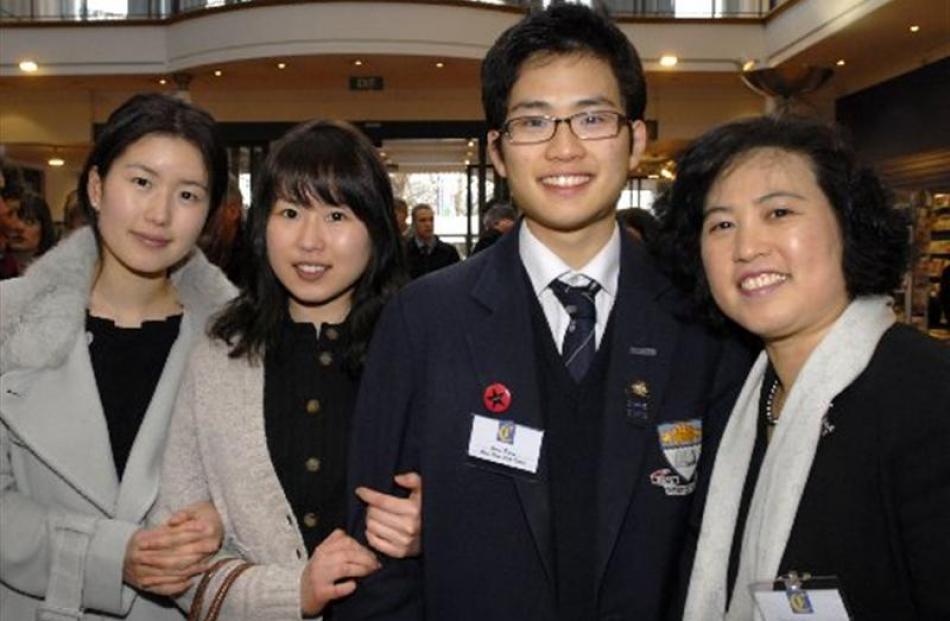 Otago Boys High School pupil and Class Act Award recipient Juno Pyun (centre right) with his...