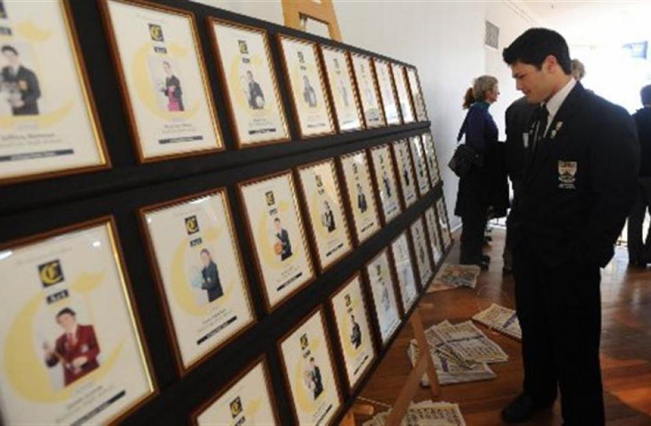 Rowan Tumai of Roxburgh Area School looks at the displayed photos.  Photo by Peter McIntosh.