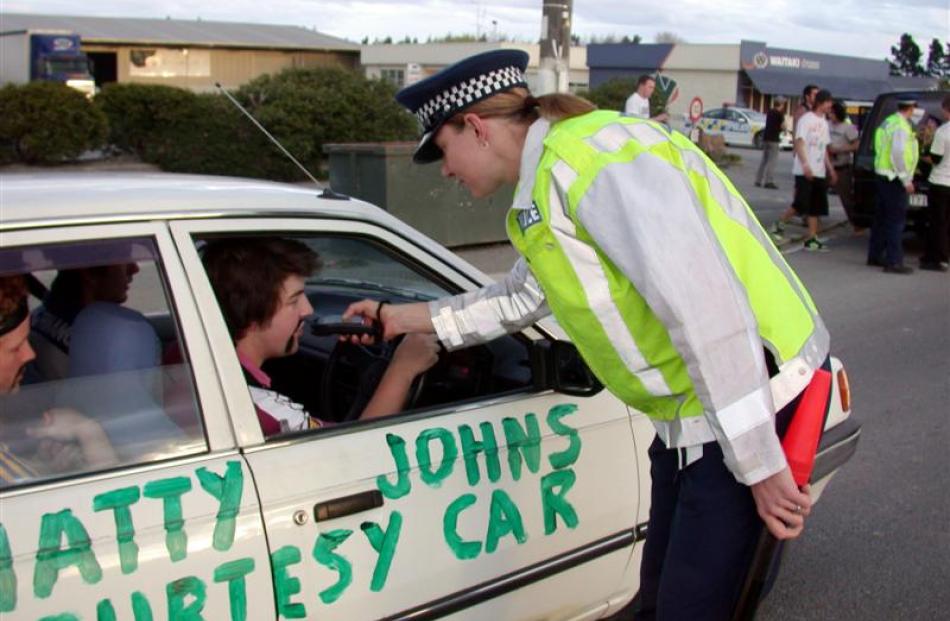 Constable Delaine Patterson, of Alexandra, does a preliminary breath test on the driver of one of...