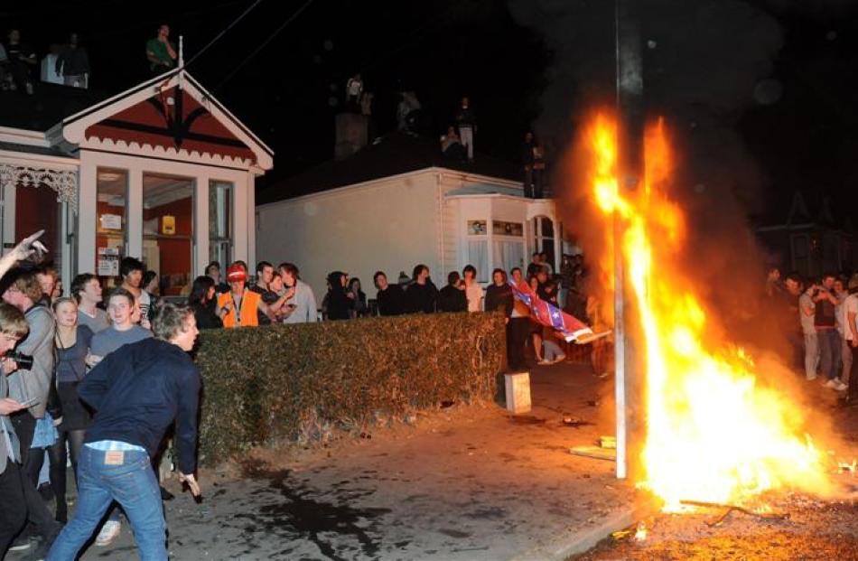 The crowd takes over in Castle St, Dunedin, last night, setting fires and pushing police out of...