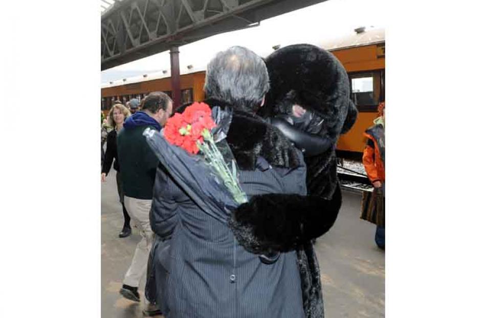 Mr Chin hugged by Chris Skellett of Warrington.