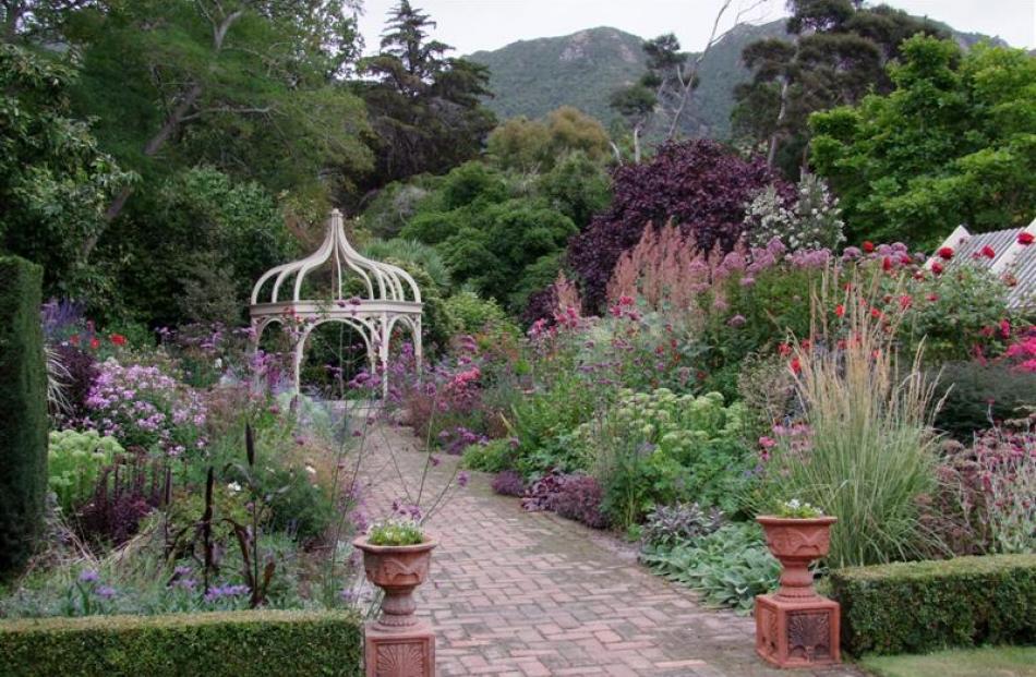 The wide herbaceous border at Ohinetahi is packed with plants in complementing colours and...