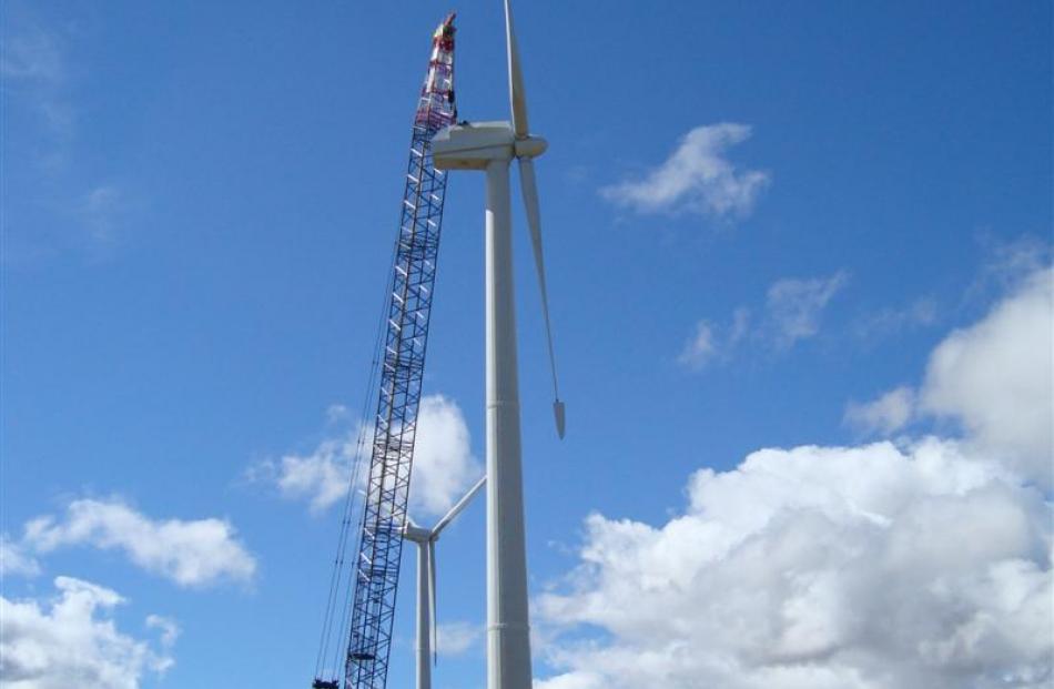 A crane works on the 45m tall wind towers. Photos supplied.
