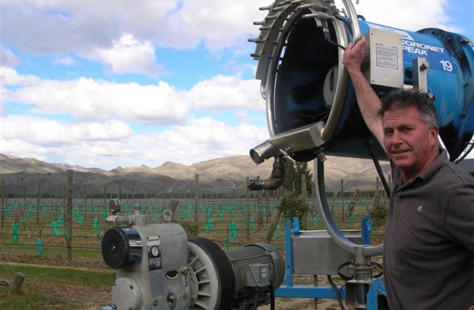 Phil Parker is trialling snow-making machines to circulate air around his vines to protect...