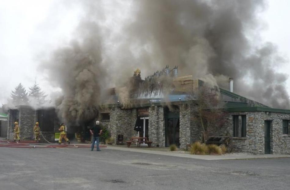 Smoke pours from the tavern. Photo by Keshia Thompson.
