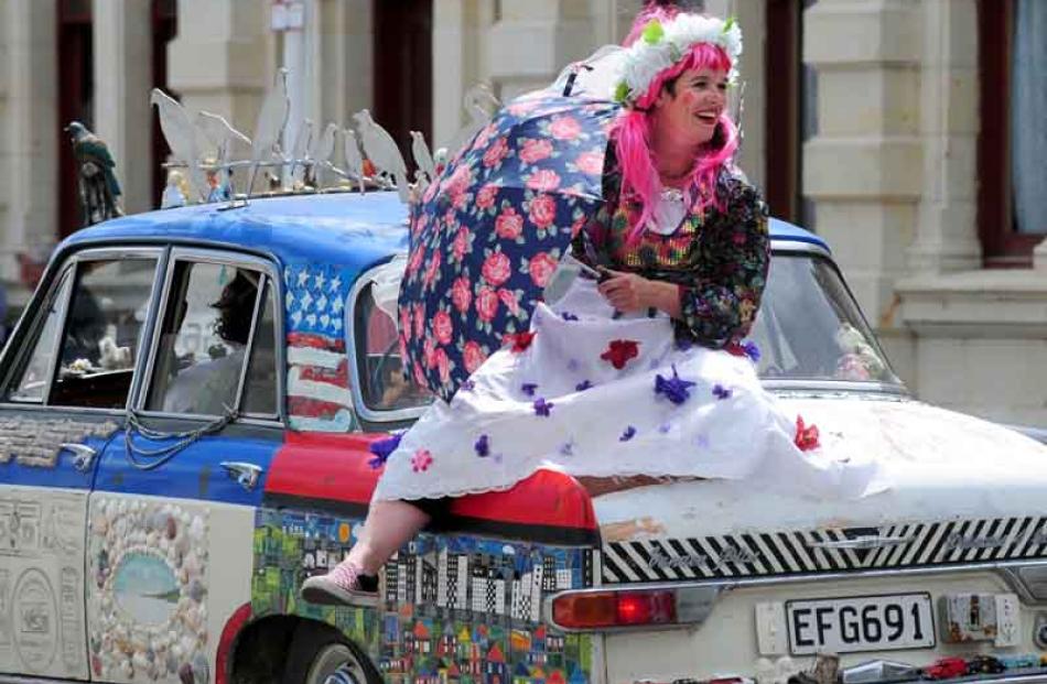 Belle of the boot . . . the inimitable Mandy Mayhem rode on the back of the ``art car'' in the...
