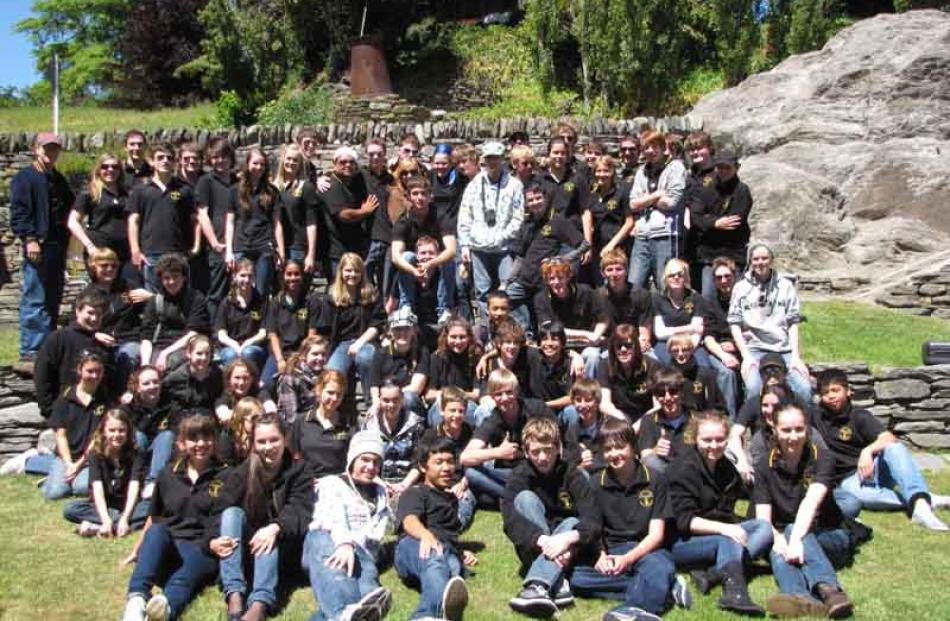 The musicians gather for a group photo.