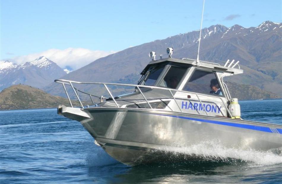 The Rogers patrol Lake Wanaka in their boat Harmony this week.