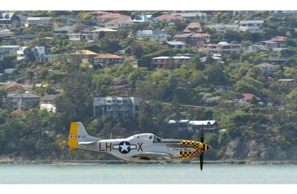 A WWII P-51 Mustang fighter over Dunedin as part of Armistice Day commemorations.