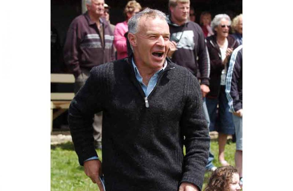 Greg McLellan of Wyndham cheers on ' Independence Day ', the winner of Race Two at the Roxburgh...