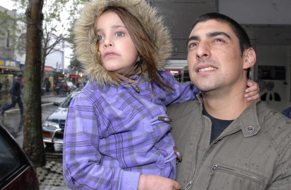 Emily (5) and James Baird (32), of Wellington dress warmly and take in the weather.