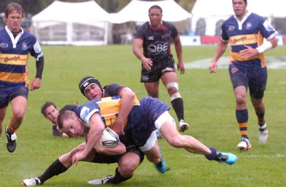 Toby Arnold of Bay of Plenty tackled by Josh York of North Harbour.