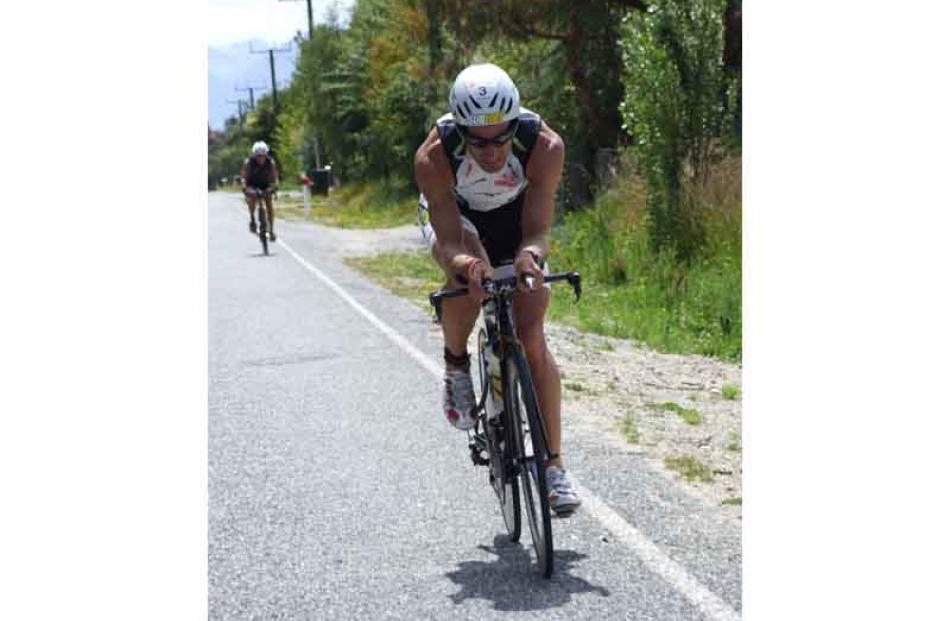 Rishard Ussher's face is a picture of determination with less than 10km to go on the 180km cycle....