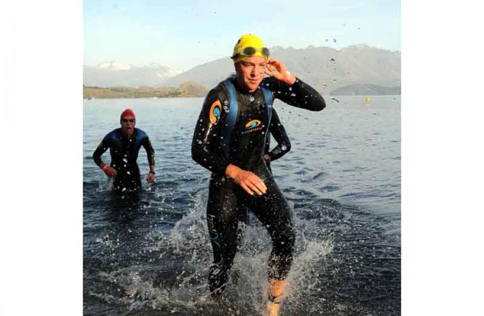 Individual womans ironman winner Gina Crawford leaves the water after her 3.8km swim in a time of...