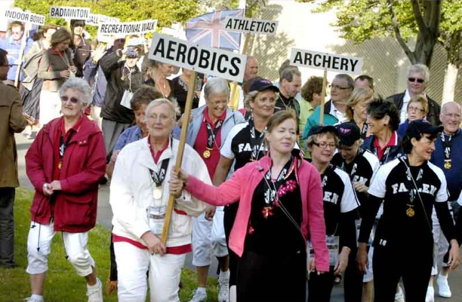 Teams march led by aerobics Jan Still.