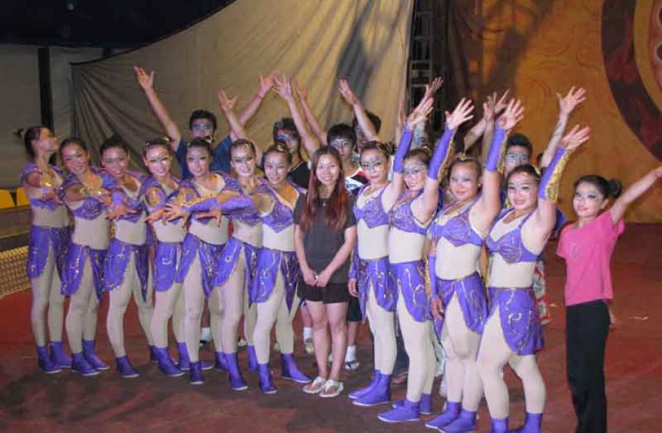 Zirka Circus owner and manager Jeni Hou (centre) caught up with her team of performers after...