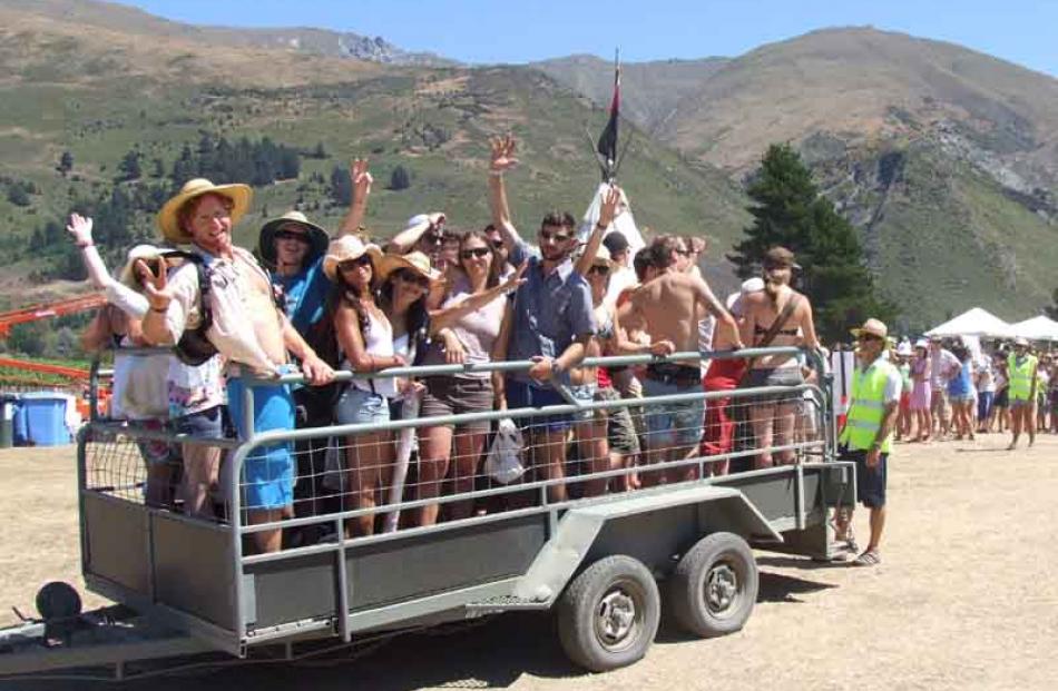 Hot Rippon festival-goers ride the shuttle down to Lake Wanaka for a swim.